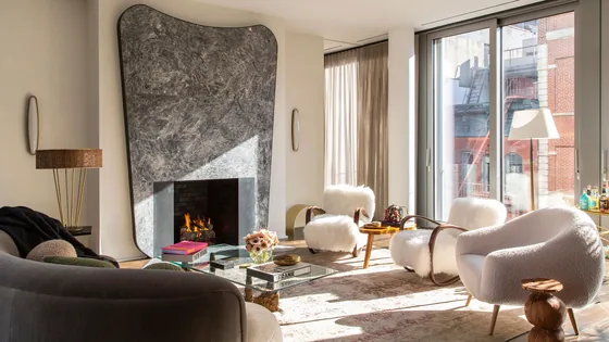 The attached reference image: a living room with a marble fireplace