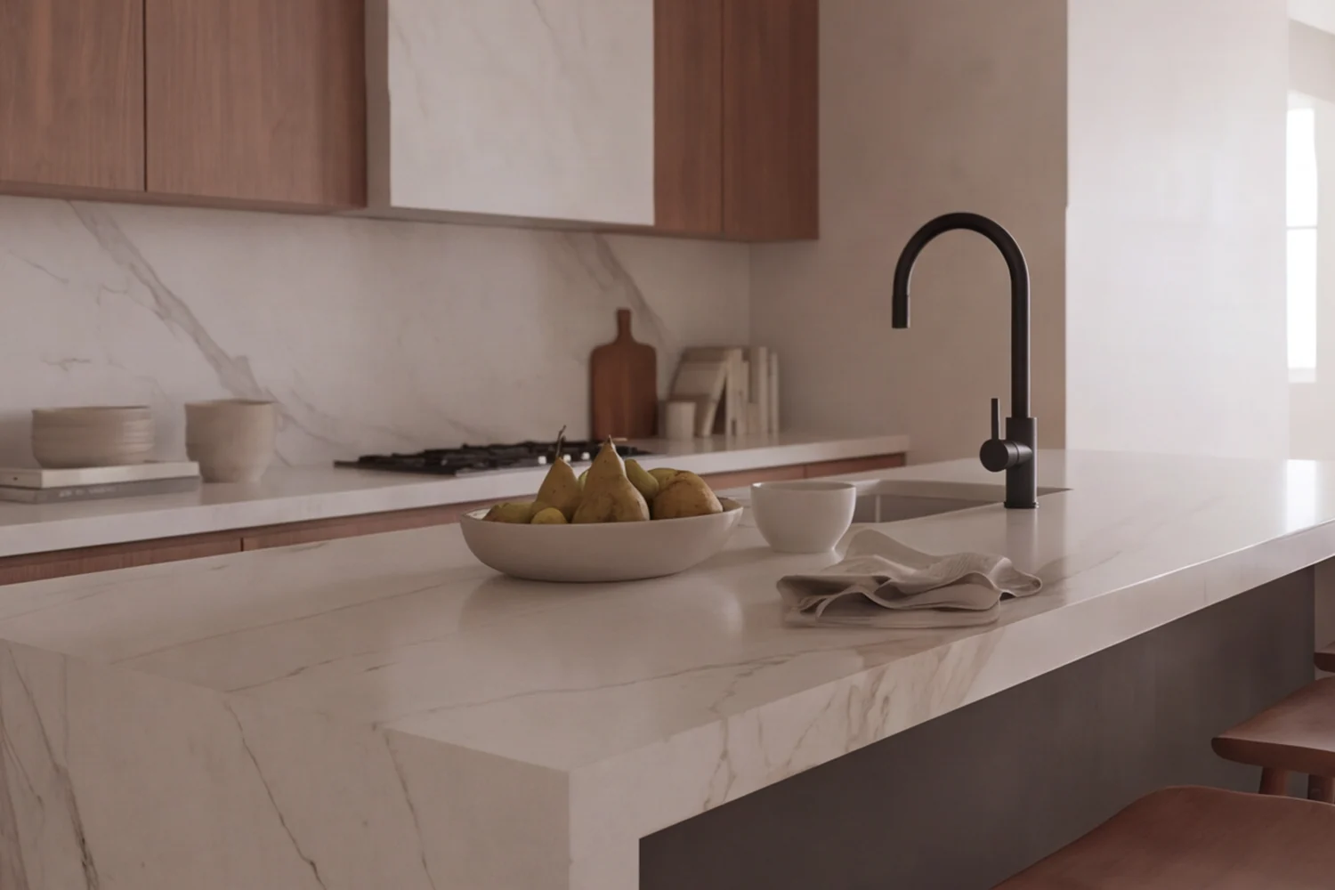 The kitchen island from close by, the wall of cabinets behind